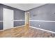 Spacious bedroom featuring chair rail detail and wood-look flooring, ready for your personal touch at 136 Rosario Dr, Summerville, SC 29483