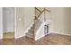 Foyer featuring stairs with wooden railing and unique pet nook with sliding barn door at 136 Rosario Dr, Summerville, SC 29483
