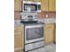 Stainless steel oven and range, wood cabinets, and granite countertops at 136 Rosario Dr, Summerville, SC 29483