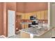 Updated kitchen featuring granite countertops, stainless steel appliances, and ample cabinet space at 136 Rosario Dr, Summerville, SC 29483