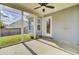 View of the backyard from the screened in porch with a ceiling fan at 136 Rosario Dr, Summerville, SC 29483