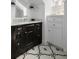 Bathroom featuring black cabinets, carrara marble countertop, and patterned tile flooring at 14 Greenhill St, Charleston, SC 29401
