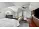 Bedroom with kitchenette, large arched window, white sofa and hardwood floors at 14 Greenhill St, Charleston, SC 29401