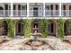 Picturesque courtyard featuring a central fountain, arches covered in greenery, and a gravel pathway at 14 Greenhill St, Charleston, SC 29401