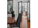 Formal dining room showcasing hardwood floors, a decorative mirror, and a view into other rooms at 14 Greenhill St, Charleston, SC 29401