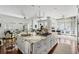 Open-concept kitchen with granite island, modern appliances, and seamless flow to living area at 14 Greenhill St, Charleston, SC 29401