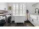 Well-lit laundry room with modern appliances, storage, and a folding table at 14 Greenhill St, Charleston, SC 29401