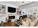 Bright living room with a fireplace, built-in shelves, and seamless flow to additional living spaces at 14 Greenhill St, Charleston, SC 29401