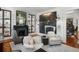 Stylish living room with a fireplace, dark wood floors, and comfortable seating arrangement at 14 Greenhill St, Charleston, SC 29401