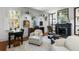 Bright living space with a fireplace, hardwood floors, and plenty of natural light from large windows at 14 Greenhill St, Charleston, SC 29401