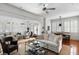 This home has an open living space with stylish furnishings, natural light, and beautiful hardwood floors at 14 Greenhill St, Charleston, SC 29401