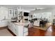 Open concept living area with a kitchen island, fireplace, and a clear view of the living room at 14 Greenhill St, Charleston, SC 29401