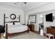 Spacious main bedroom boasting natural light, hardwood floors, and en-suite bathroom at 14 Greenhill St, Charleston, SC 29401