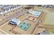 Aerial view of a Primary-planned community featuring a pool, playground, tennis courts, and walking trails at 1427 Homecoming Blvd, Ravenel, SC 29470