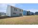 Spacious backyard featuring a well-maintained lawn and a charming two-story home in a Gathering-friendly neighborhood at 1427 Homecoming Blvd, Ravenel, SC 29470