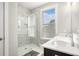 This bathroom features a glass shower, white marble, and a double sink for optimal convenience at 1427 Homecoming Blvd, Ravenel, SC 29470