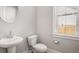 Cozy bathroom features modern fixtures, toilet, sink, and window for natural lighting at 1427 Homecoming Blvd, Ravenel, SC 29470