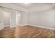 This large bedroom is highlighted by bright windows and hardwood floors, a great space to relax at 1427 Homecoming Blvd, Ravenel, SC 29470