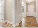 Spacious foyer with hardwood flooring, white wainscoting, and natural light at 1427 Homecoming Blvd, Ravenel, SC 29470
