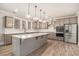 Modern kitchen featuring gray cabinetry, island with quartz counters, and pendant lighting at 1427 Homecoming Blvd, Ravenel, SC 29470