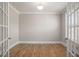 Bright office space features hardwood floors, neutral walls, and glass French doors at 1427 Homecoming Blvd, Ravenel, SC 29470