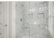 This marble walk in shower offers bright light and shelving for maximum bathroom storage at 1427 Homecoming Blvd, Ravenel, SC 29470