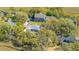 Aerial view of homes nestled amongst trees and overlooking the marsh at 1521 Hurtes Island Dr, Charleston, SC 29407