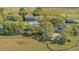 Aerial view of homes nestled amongst trees and overlooking the marsh at 1521 Hurtes Island Dr, Charleston, SC 29407