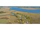 A waterfront property with a private dock sits along winding marsh waterways, with a view of the coast at 1521 Hurtes Island Dr, Charleston, SC 29407