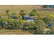 Aerial view of homes nestled amongst trees and overlooking the marsh at 1521 Hurtes Island Dr, Charleston, SC 29407