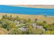 Aerial view of homes nestled amongst trees and overlooking the marsh and river at 1521 Hurtes Island Dr, Charleston, SC 29407
