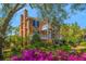 Beautiful brick home with dual back porches and vibrant flowers in the garden at 1521 Hurtes Island Dr, Charleston, SC 29407