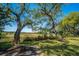 Expansive backyard featuring lush greenery and serene views of the marsh at 1521 Hurtes Island Dr, Charleston, SC 29407