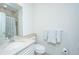 Well-lit bathroom with a vanity, toilet, and shower featuring neutral tones at 1521 Hurtes Island Dr, Charleston, SC 29407
