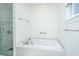 Spacious bathroom showcasing a modern soaking tub, shower, and neutral finishes at 1521 Hurtes Island Dr, Charleston, SC 29407