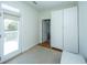 Bedroom with light walls, a balcony door and an interior closet with white trim at 1521 Hurtes Island Dr, Charleston, SC 29407