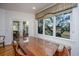 Bright dining area with bench seating and a large window offering beautiful outdoor views at 1521 Hurtes Island Dr, Charleston, SC 29407