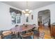 Dining room featuring hardwood floors, and designer lighting. Leads to staircase to upper floors at 1521 Hurtes Island Dr, Charleston, SC 29407