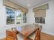 Cozy dining area featuring a large table and bench seating with window views at 1521 Hurtes Island Dr, Charleston, SC 29407