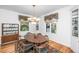 Formal dining room with wood table, stylish chairs, chandelier, and elegant built-in cabinet at 1521 Hurtes Island Dr, Charleston, SC 29407