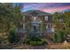 Stunning two-story brick home with dual porches, mature trees, and professional landscaping at 1521 Hurtes Island Dr, Charleston, SC 29407