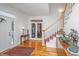 Inviting foyer with gleaming hardwood floors and a staircase, radiating warmth at 1521 Hurtes Island Dr, Charleston, SC 29407