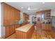 Bright kitchen with custom cabinetry, hardwood floors, an island, and modern appliances at 1521 Hurtes Island Dr, Charleston, SC 29407