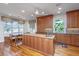 Spacious kitchen with an island, hardwood floors, and ample natural light at 1521 Hurtes Island Dr, Charleston, SC 29407