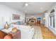 Spacious living room with a cozy fireplace, ceiling fan and large sectional couch at 1521 Hurtes Island Dr, Charleston, SC 29407