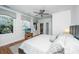 Relaxing main bedroom with soft carpet, large windows, and ceiling fan, offering tranquil views at 1521 Hurtes Island Dr, Charleston, SC 29407