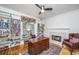 Cozy office with custom built-in bookshelves, fireplace, plush rug, and traditional furnishings at 1521 Hurtes Island Dr, Charleston, SC 29407