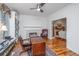 Bright office boasts a fireplace, and hardwood floors, and an expansive view of adjacent room at 1521 Hurtes Island Dr, Charleston, SC 29407