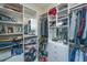 Spacious walk-in closet with custom storage, multiple rods and shelving for clothing and accessories at 1521 Hurtes Island Dr, Charleston, SC 29407