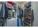 Organized walk-in closet with custom shelving for shoes, clothes, and accessories at 1521 Hurtes Island Dr, Charleston, SC 29407